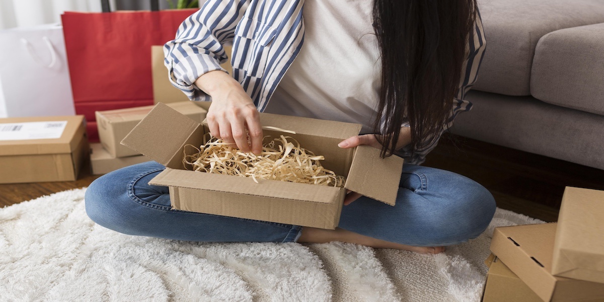 high-angle-woman-unboxing