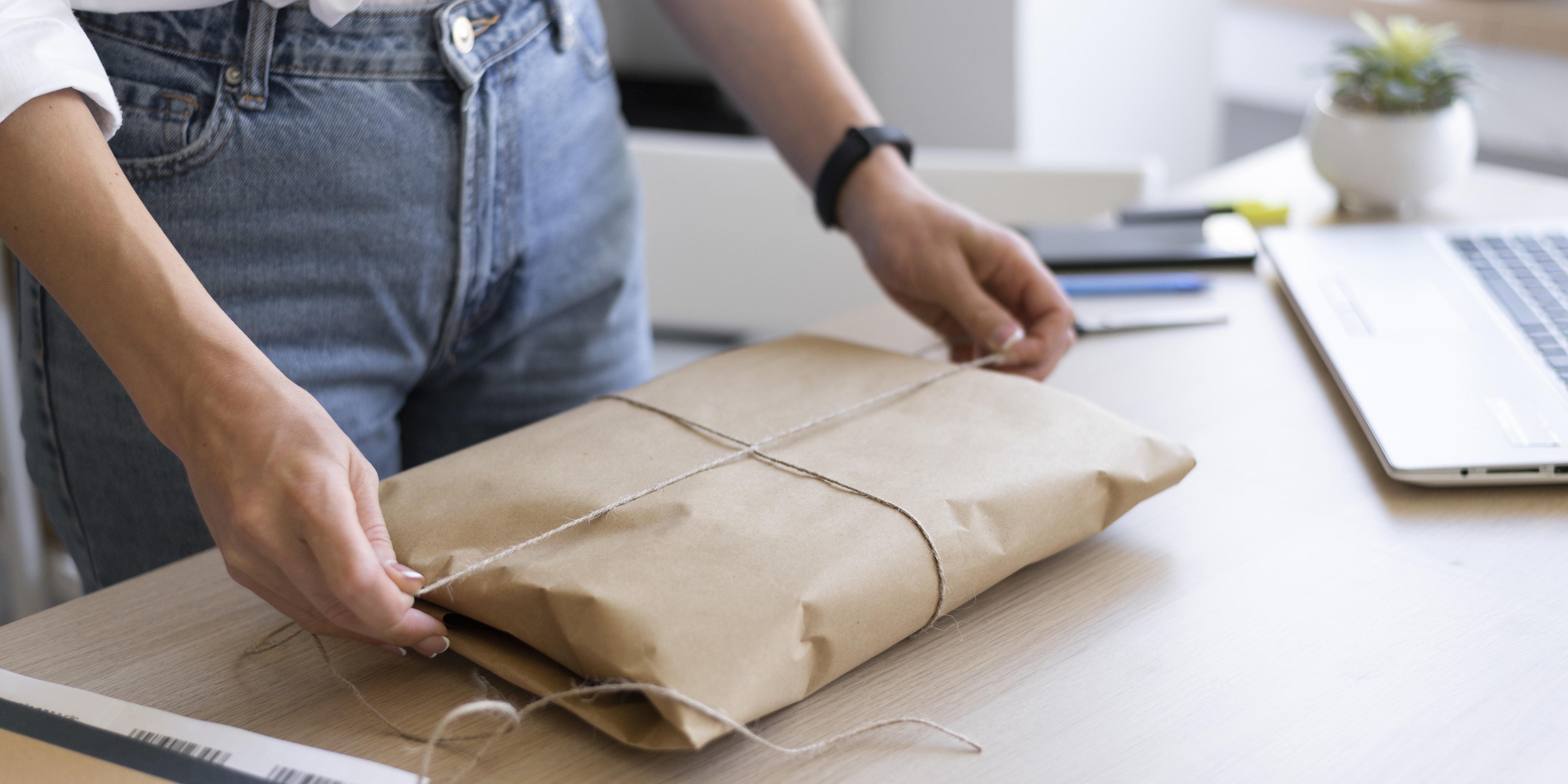 women tying twine as a low cost option for packaging