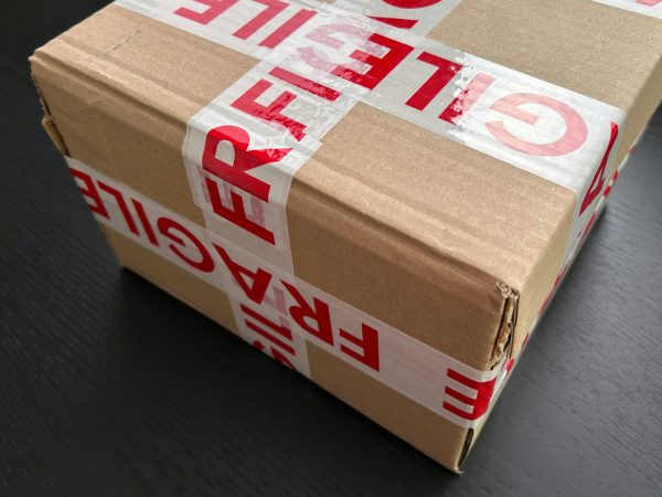 generic packaging wrapped with fragile tape