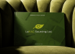 LeKAC brand guide sitting on green velvet chair