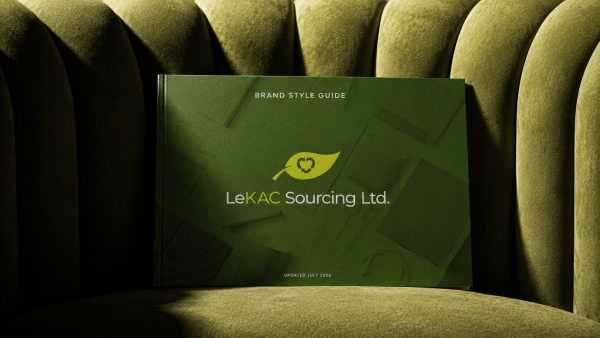 2-Mockup_StyleGuide LeKAC brand guide sitting on green velvet chair